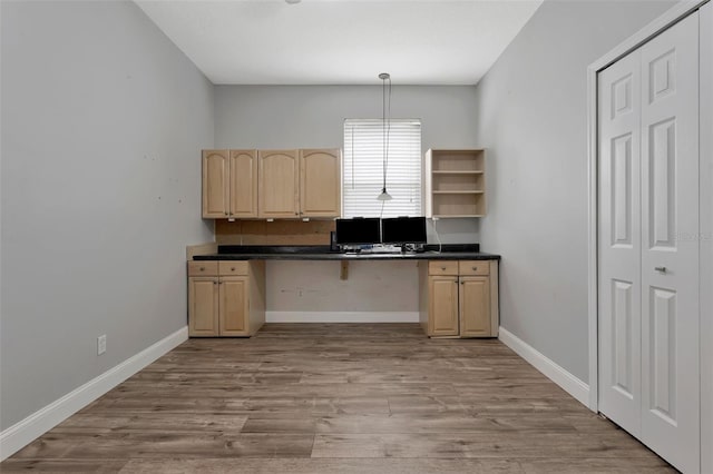 12411 Scarlett Sage Ct, Winter Garden, FL 34787 - unfurnished office with built in study area, light wood-style floors, and baseboards