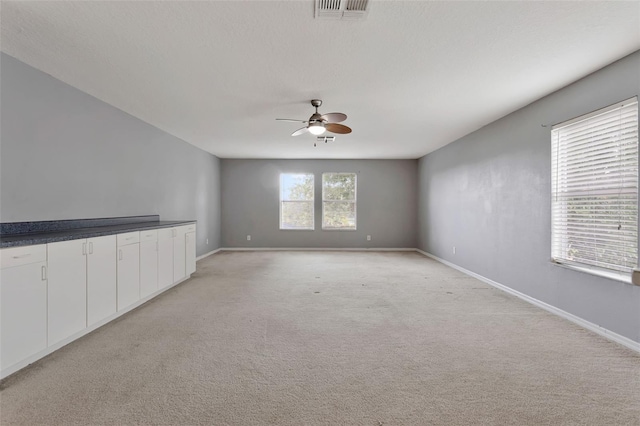 12411 Scarlett Sage Ct, Winter Garden, FL 34787 - spare room with ceiling fan, light colored carpet, and baseboards