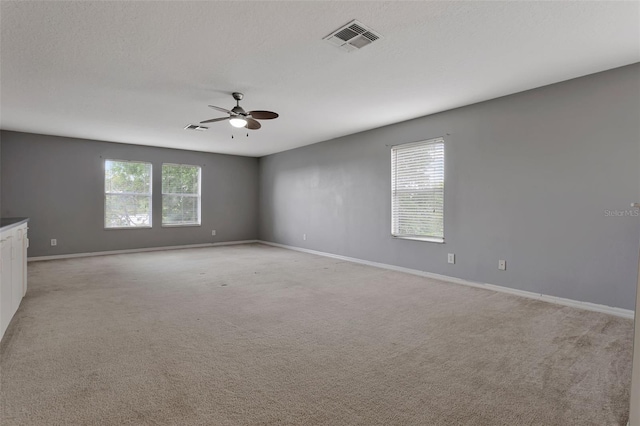 12411 Scarlett Sage Ct, Winter Garden, FL 34787 - unfurnished room with a ceiling fan, baseboards, and light colored carpet
