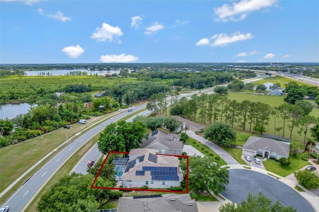 12411 Scarlett Sage Ct, Winter Garden, FL 34787 - aerial view of property's location featuring a nearby body of water, property boundaries highlighted, a highway, and a tree filled landscape
