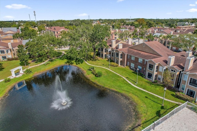 aerial view of residential area featuring a nearby body of water