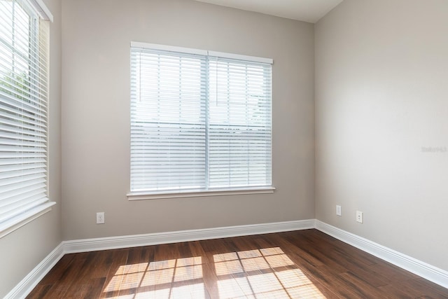 625 Pavia Loop, Lake Mary, FL 32746 - spare room featuring dark wood-style flooring and baseboards