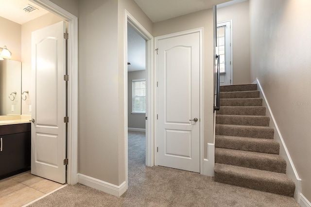 625 Pavia Loop, Lake Mary, FL 32746 - staircase with baseboards and carpet floors