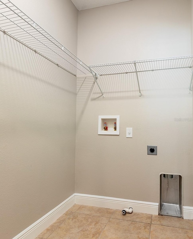 625 Pavia Loop, Lake Mary, FL 32746 - clothes washing area with hookup for a washing machine, hookup for an electric dryer, baseboards, and light tile patterned floors