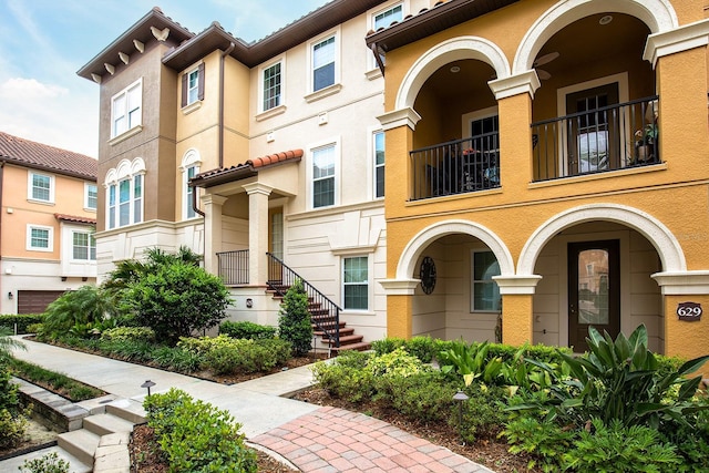 625 Pavia Loop, Lake Mary, FL 32746 - view of front of house featuring a balcony and stucco siding