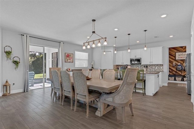 2539 Auburn Ridge Dr, Apopka, FL 32712 - dining room with wood finished floors, recessed lighting, and baseboards