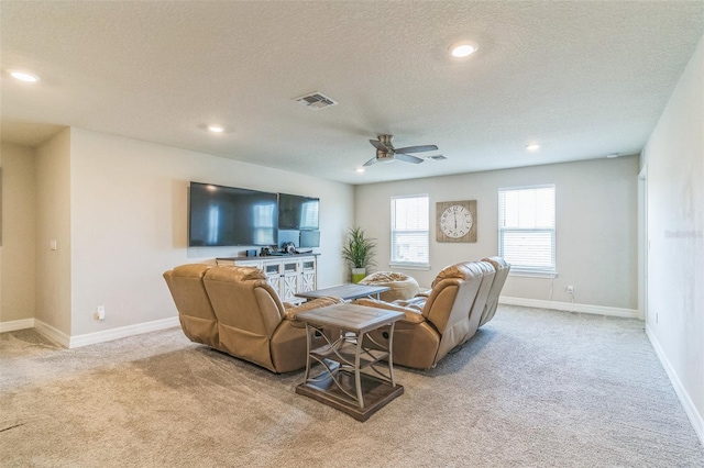 2539 Auburn Ridge Dr, Apopka, FL 32712 - carpeted living room featuring a ceiling fan, a textured ceiling, recessed lighting, and baseboards