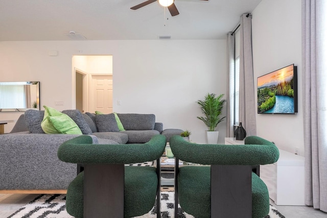 living area with a ceiling fan