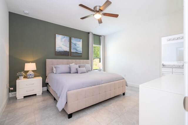 bedroom featuring baseboards, light tile patterned floors, and a ceiling fan