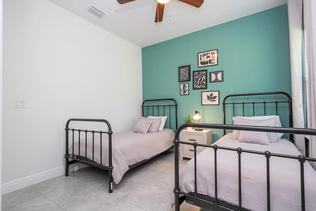 bedroom with tile patterned flooring, baseboards, and ceiling fan