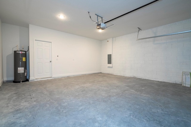 garage featuring electric water heater, a garage door opener, electric panel, and concrete block wall