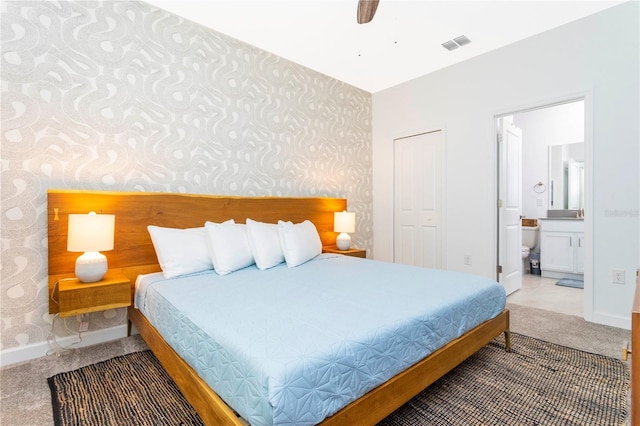 2836 Simile St, Kissimmee, FL 34746 - carpeted bedroom featuring wallpapered walls, baseboards, ensuite bath, and a ceiling fan