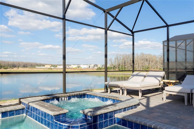 2836 Simile St, Kissimmee, FL 34746 - view of swimming pool featuring a water view, a lanai, and a pool with connected hot tub