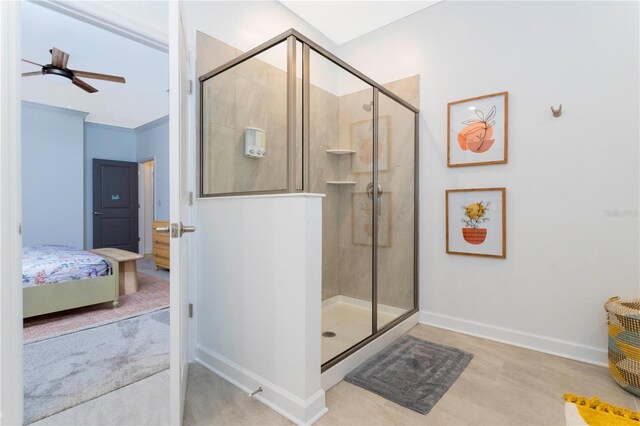 2836 Simile St, Kissimmee, FL 34746 - ensuite bathroom featuring ceiling fan, a shower stall, and baseboards