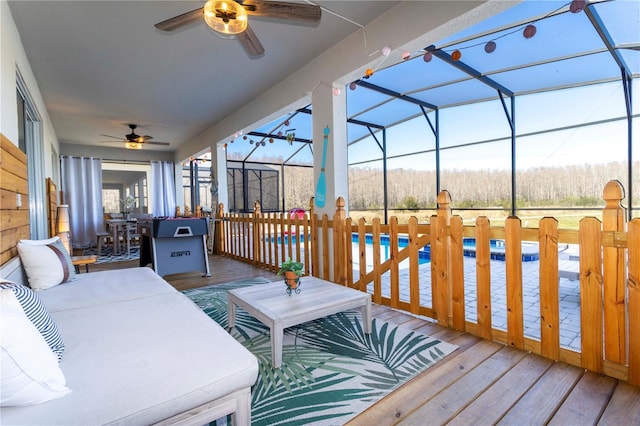 2836 Simile St, Kissimmee, FL 34746 - wooden terrace with a ceiling fan, an outdoor pool, a lanai, outdoor dining space, and a patio area