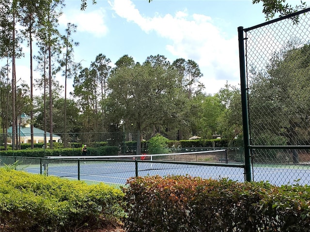 view of tennis court with fence
