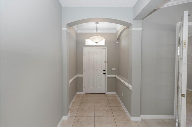 6728 Duncaster St, Windermere, FL 34786 - doorway featuring arched walkways, ornamental molding, and baseboards