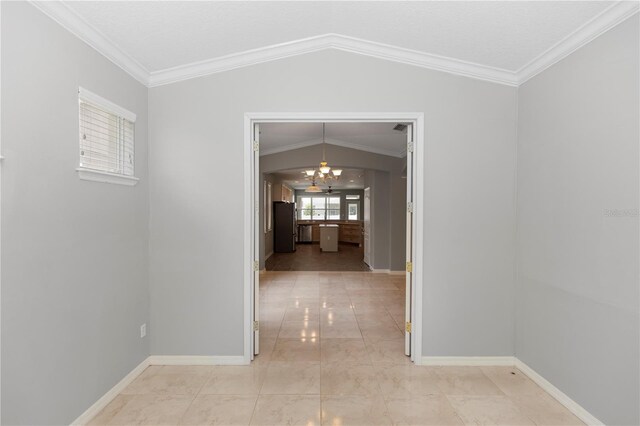 6728 Duncaster St, Windermere, FL 34786 - hallway with a chandelier, lofted ceiling, ornamental molding, baseboards, and light marble finish flooring