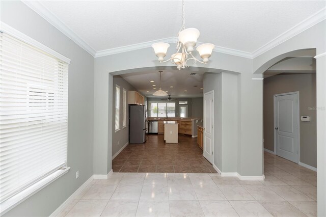 6728 Duncaster St, Windermere, FL 34786 - kitchen featuring stainless steel appliances, arched walkways, ceiling fan, crown molding, and a chandelier