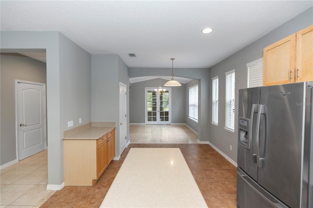 6728 Duncaster St, Windermere, FL 34786 - kitchen featuring stainless steel refrigerator with ice dispenser, light brown cabinetry, light countertops, light tile patterned flooring, and recessed lighting