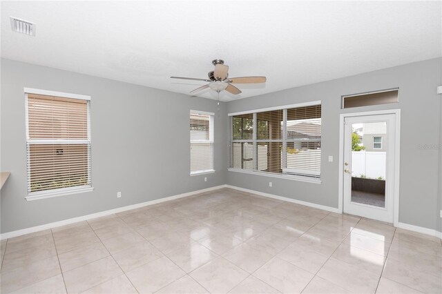 6728 Duncaster St, Windermere, FL 34786 - spare room with ceiling fan, plenty of natural light, and light tile patterned floors