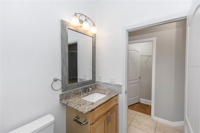 6728 Duncaster St, Windermere, FL 34786 - bathroom featuring vanity, toilet, and tile patterned floors