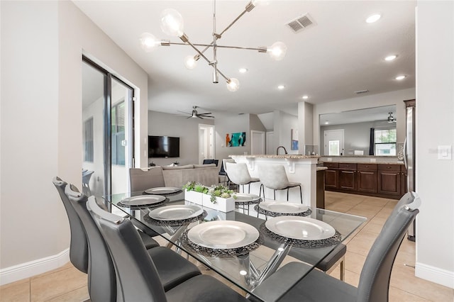 dining room featuring light tile patterned flooring, a chandelier, recessed lighting, ceiling fan, and baseboards