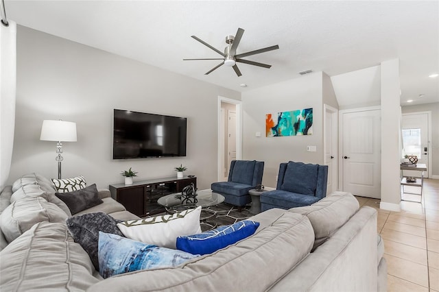 living area with light tile patterned floors, ceiling fan, recessed lighting, and baseboards