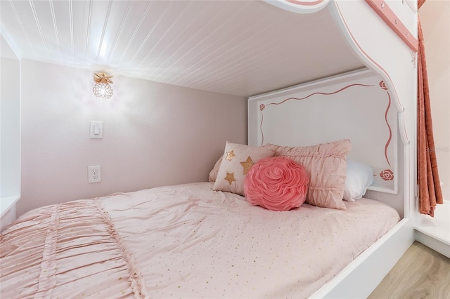 bedroom featuring wood finished floors