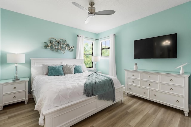 bedroom with wood finished floors and ceiling fan