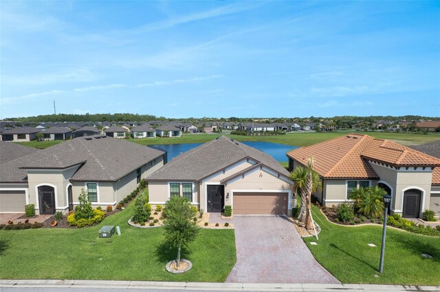 636 San Augusto Dr, Kissimmee, FL 34759 - ranch-style house with an attached garage, a residential view, driveway, and stucco siding