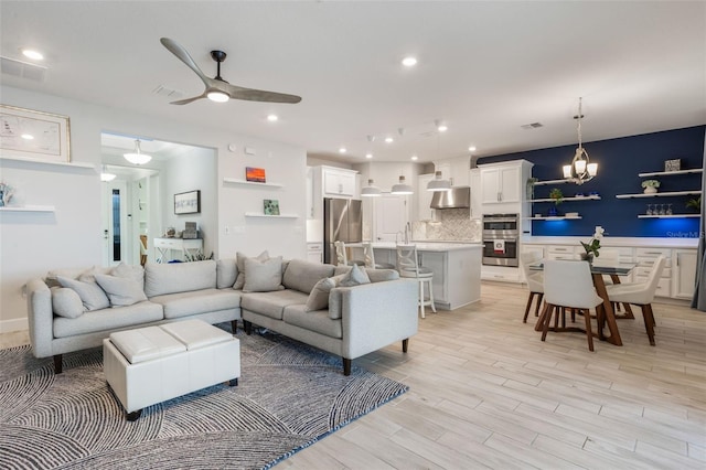 636 San Augusto Dr, Kissimmee, FL 34759 - living area with ceiling fan, a chandelier, light wood finished floors, and recessed lighting