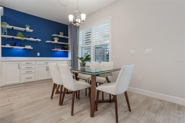 636 San Augusto Dr, Kissimmee, FL 34759 - dining room featuring light wood-type flooring and a chandelier