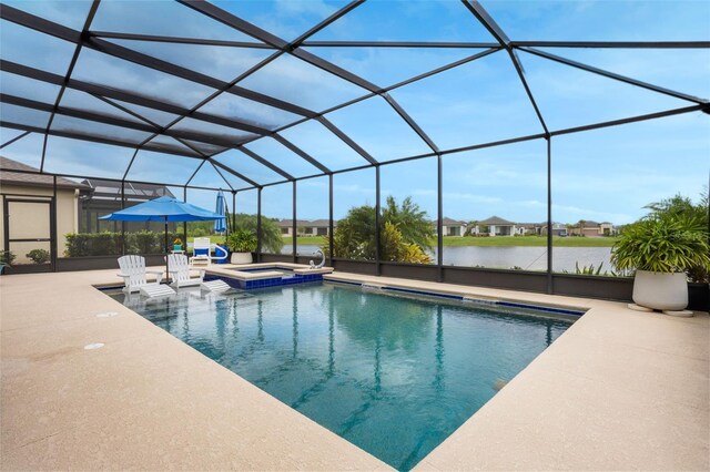 636 San Augusto Dr, Kissimmee, FL 34759 - view of swimming pool featuring a pool with connected hot tub, a patio area, and glass enclosure