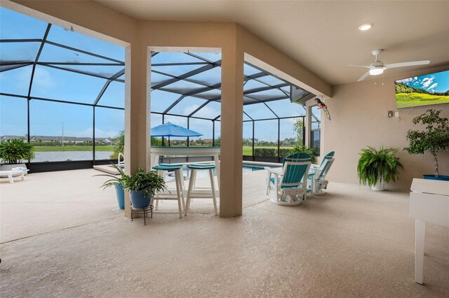 636 San Augusto Dr, Kissimmee, FL 34759 - view of patio featuring ceiling fan, an outdoor pool, and glass enclosure