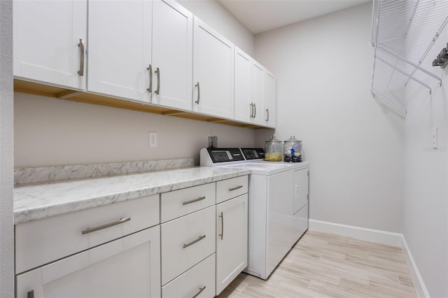 636 San Augusto Dr, Kissimmee, FL 34759 - laundry area with separate washer and dryer, cabinet space, light wood-style flooring, and baseboards