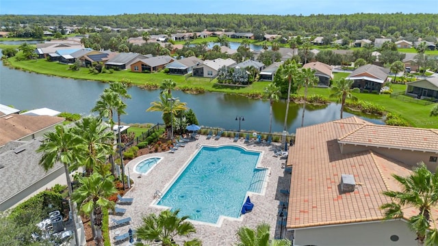 636 San Augusto Dr, Kissimmee, FL 34759 - aerial view of residential area featuring a nearby body of water and a pool area