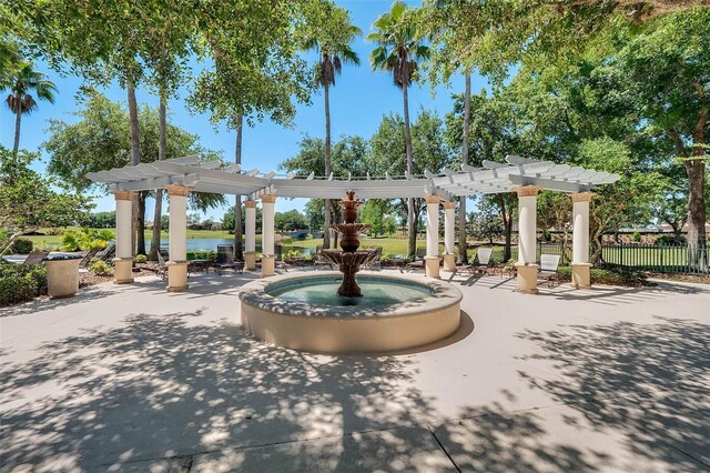 636 San Augusto Dr, Kissimmee, FL 34759 - view of community with a pergola, a patio, and a water view