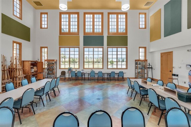 636 San Augusto Dr, Kissimmee, FL 34759 - dining space featuring a high ceiling and healthy amount of natural light