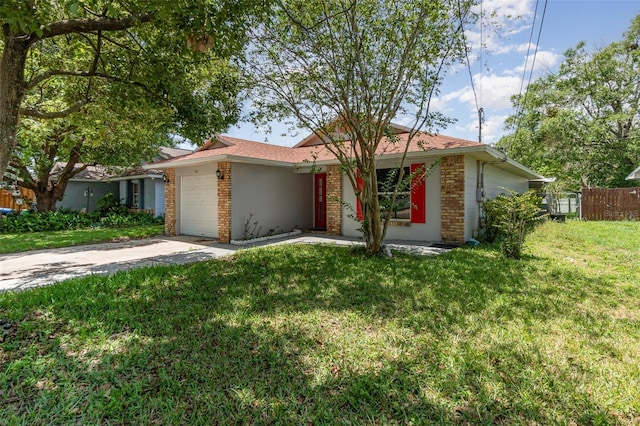 ranch-style house featuring concrete driveway, a garage, brick siding, and stucco siding