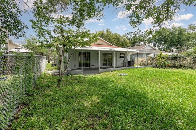 back of property featuring a sunroom and cooling unit