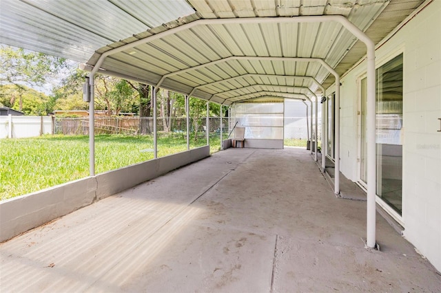 view of parking / parking lot featuring a carport