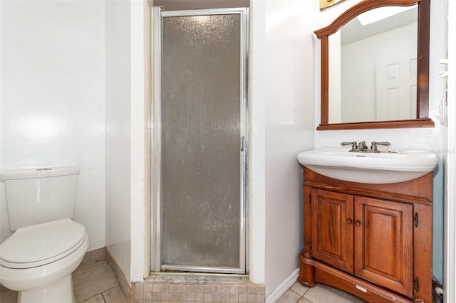 full bath featuring tile patterned flooring, a stall shower, toilet, vanity, and baseboards