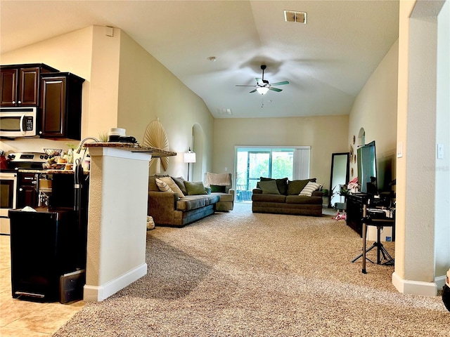 1474 Lakeside Ave, Davenport, FL 33837 - living room with light carpet, ceiling fan, lofted ceiling, and baseboards