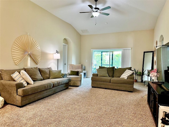 1474 Lakeside Ave, Davenport, FL 33837 - carpeted living area with lofted ceiling, arched walkways, and a ceiling fan