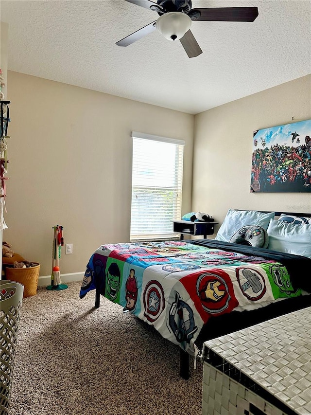 1474 Lakeside Ave, Davenport, FL 33837 - carpeted bedroom with a ceiling fan, a textured ceiling, and baseboards