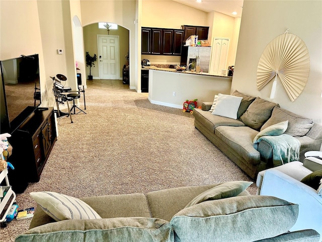 1474 Lakeside Ave, Davenport, FL 33837 - living room featuring light colored carpet, arched walkways, baseboards, and recessed lighting