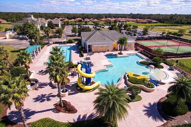 1474 Lakeside Ave, Davenport, FL 33837 - community pool with a water slide, a patio, and a water play area