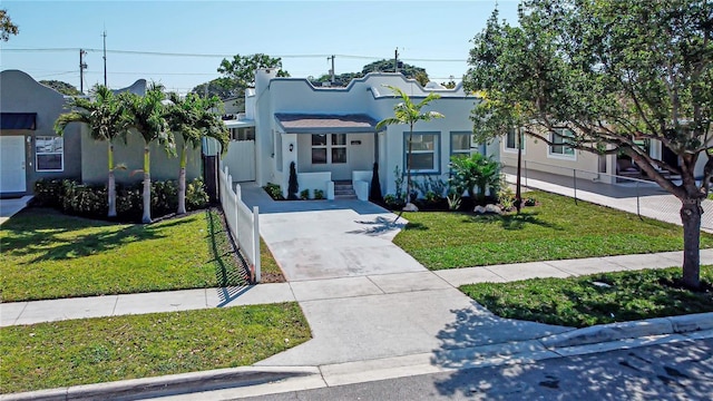 4324 Garden Ave, West Palm Beach, FL 33405 - mediterranean / spanish-style house featuring stucco siding and concrete driveway