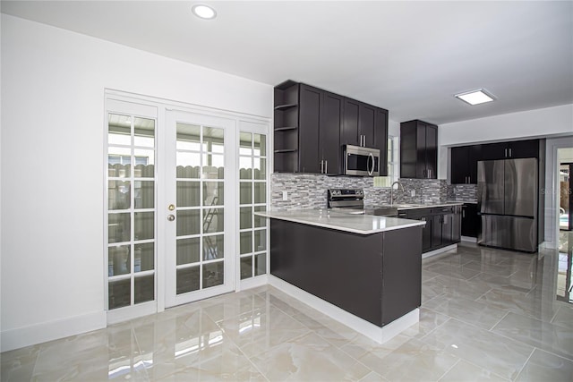 4324 Garden Ave, West Palm Beach, FL 33405 - kitchen with appliances with stainless steel finishes, open shelves, a sink, light countertops, and backsplash